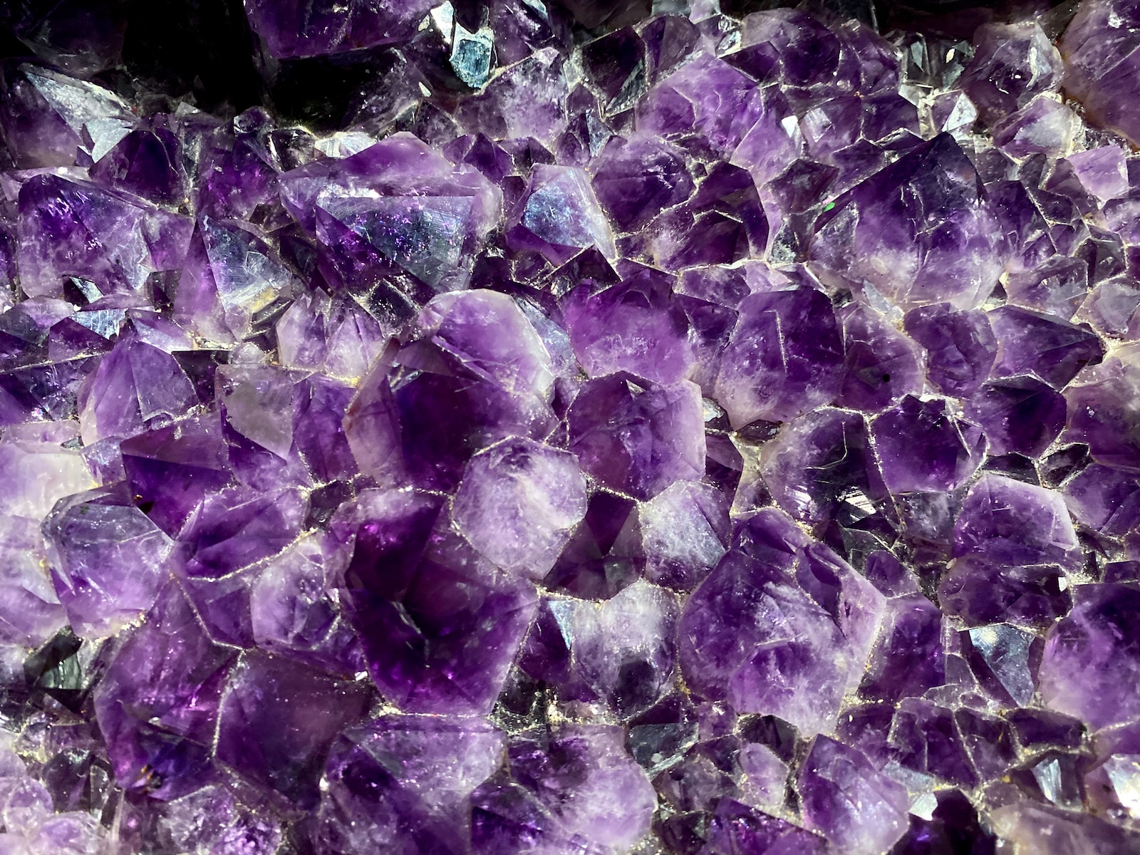 a close up of a bunch of purple rocks